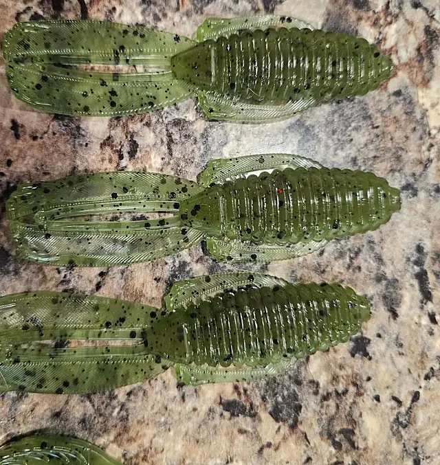 Three green pumpkin craws with black flake and flapping claws